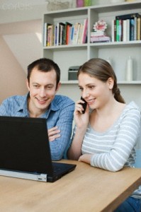 Young couple using laptop