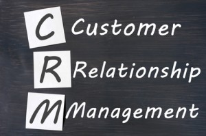 Acronym of CRM - Customer Relationship Management written on a blackboard crm-holiday-christmas-marketing