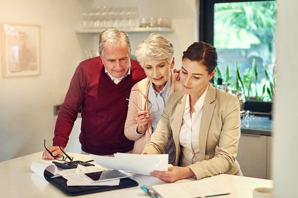 Shot of a senior couple getting advice from their financial consultant