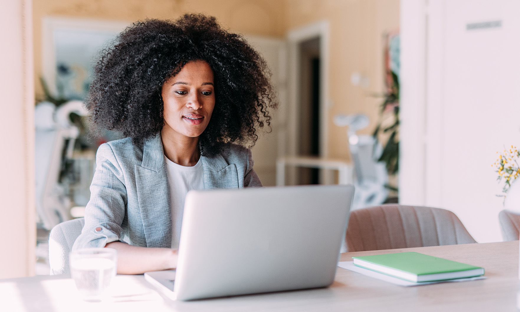apartment seeker looks at a laptop