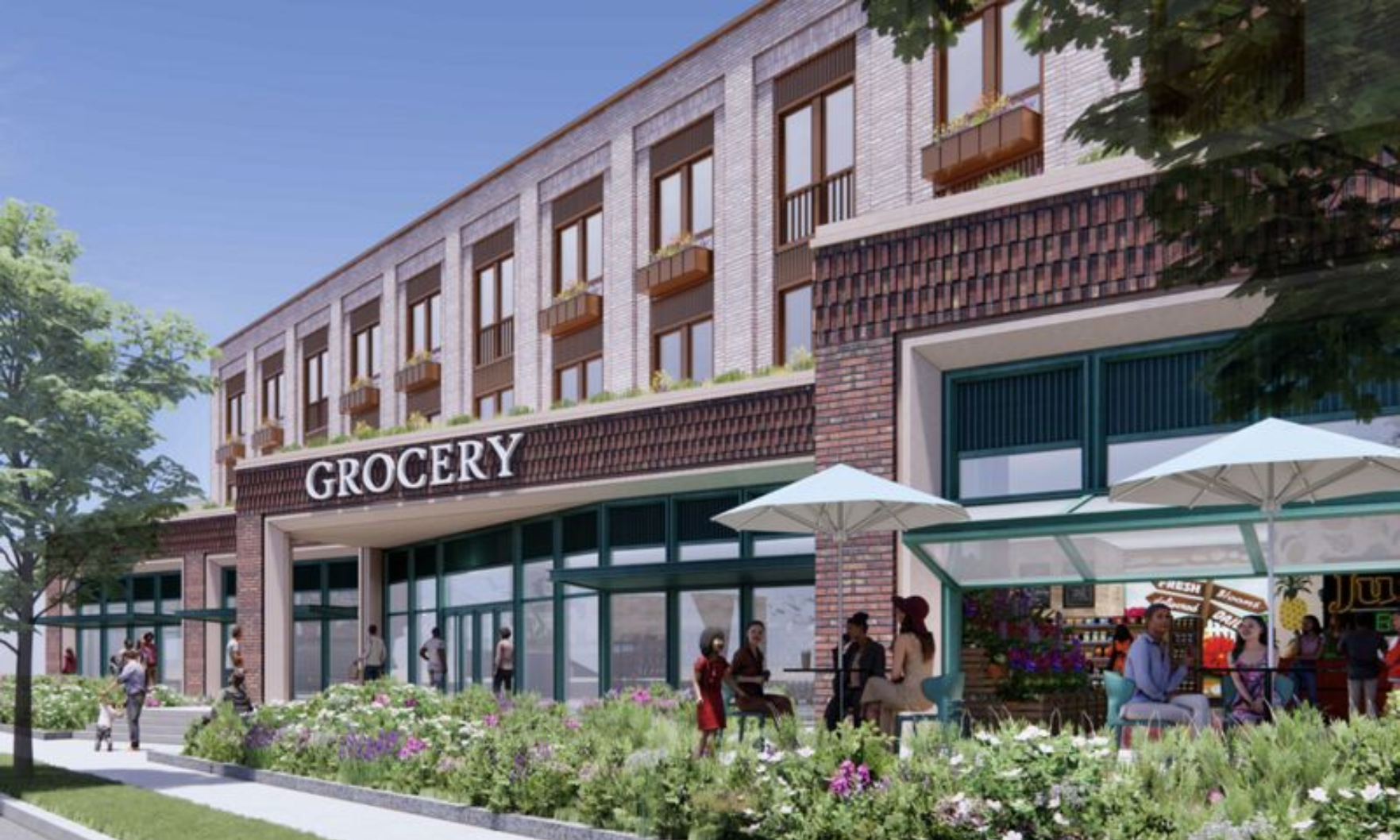 Brick exterior of a Charlestown develompent featuring a grocery story on the ground floor and apartments on the 2nd and 3rd floors.